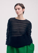 A model wears the ISSEY MIYAKE MOVING KNIT clothing.