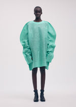 A model wears the ISSEY MIYAKE PANINI tunic.