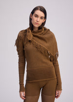 A model wears the ISSEY MIYAKE CROCHET AP STOLE stole.