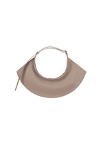 A detail shot of the ISSEY MIYAKE FIN BAG bags.