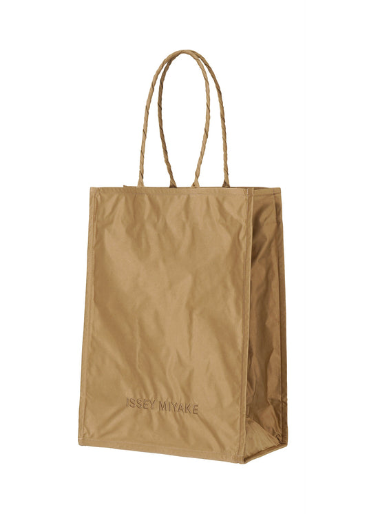 A product shot of the ISSEY MIYAKE CRUMPLABLE bag in light brown (43).