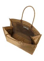 A detail shot of the ISSEY MIYAKE CRUMPLABLE bag.