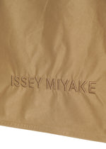 A detail shot of the ISSEY MIYAKE CRUMPLABLE bag.