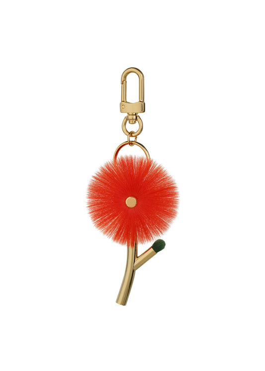 A product shot of the ISSEY MIYAKE ENGINEERED FLOWER ACC accessory in macaw red (28).