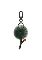 A product shot of the ISSEY MIYAKE ENGINEERED FLOWER ACC accessory in dark green (63).