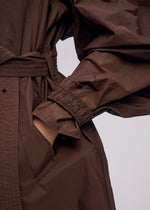 A model wears the ISSEY MIYAKE AKIMBO clothing.