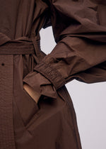 A model wears the ISSEY MIYAKE AKIMBO clothing.