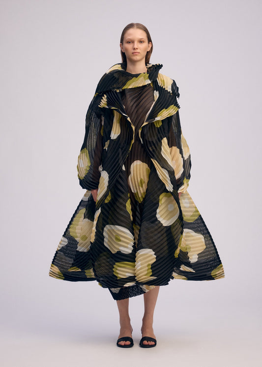A model wears the ISSEY MIYAKE VERVE coat.