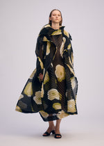 A model wears the ISSEY MIYAKE VERVE coat.