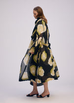 A model wears the ISSEY MIYAKE VERVE coat.