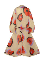 A detail shot of the ISSEY MIYAKE VERVE coat.