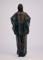 A model wears the ISSEY MIYAKE DRAW TO FORM jacket.