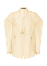 A product shot of the ISSEY MIYAKE DRAW TO FORM jacket in emu beige (48).