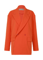 A product shot of the ISSEY MIYAKE LOOPED jacket in macaw red (28).