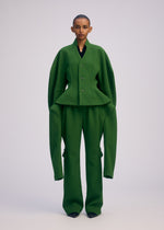 A model wears the ISSEY MIYAKE ARMS clothing.