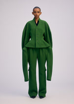 A model wears the ISSEY MIYAKE ARMS clothing.