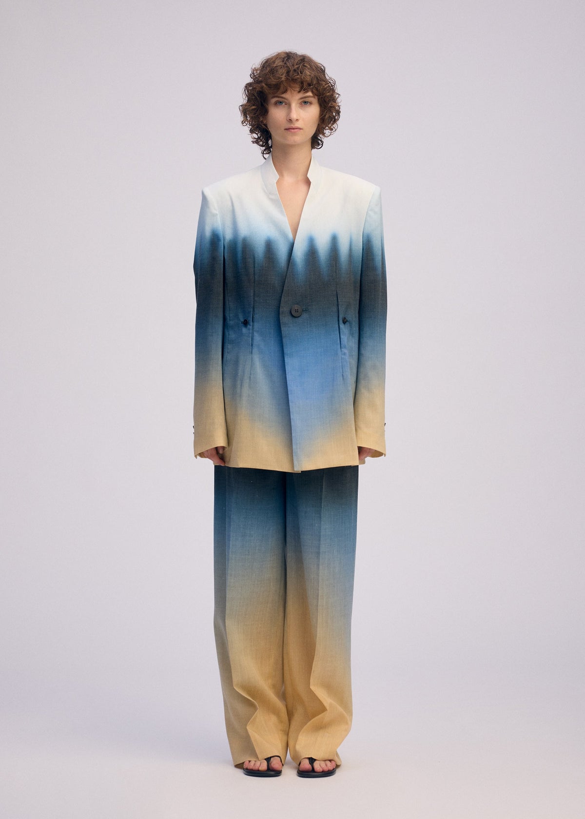 A model wears the ISSEY MIYAKE PLUMAGE plumage-jacket-starling.