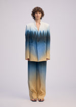 A model wears the ISSEY MIYAKE PLUMAGE plumage-jacket-starling.