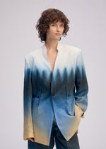 A model wears the ISSEY MIYAKE PLUMAGE plumage-jacket-chukar.