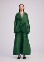 A model wears the ISSEY MIYAKE CIRCLE PLEATS PB jacket.