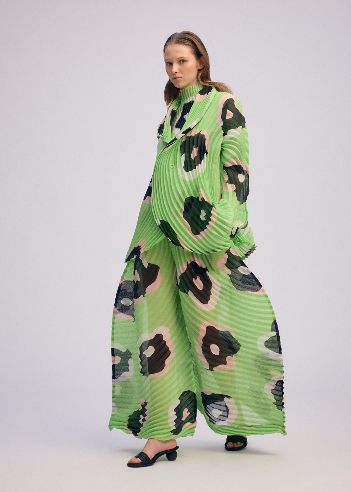 A model wears the ISSEY MIYAKE VERVE jacket.