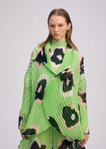A model wears the ISSEY MIYAKE VERVE jacket.