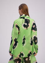 A model wears the ISSEY MIYAKE VERVE jacket.