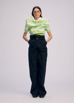 A model wears the ISSEY MIYAKE GENERIC WEAR trousers.