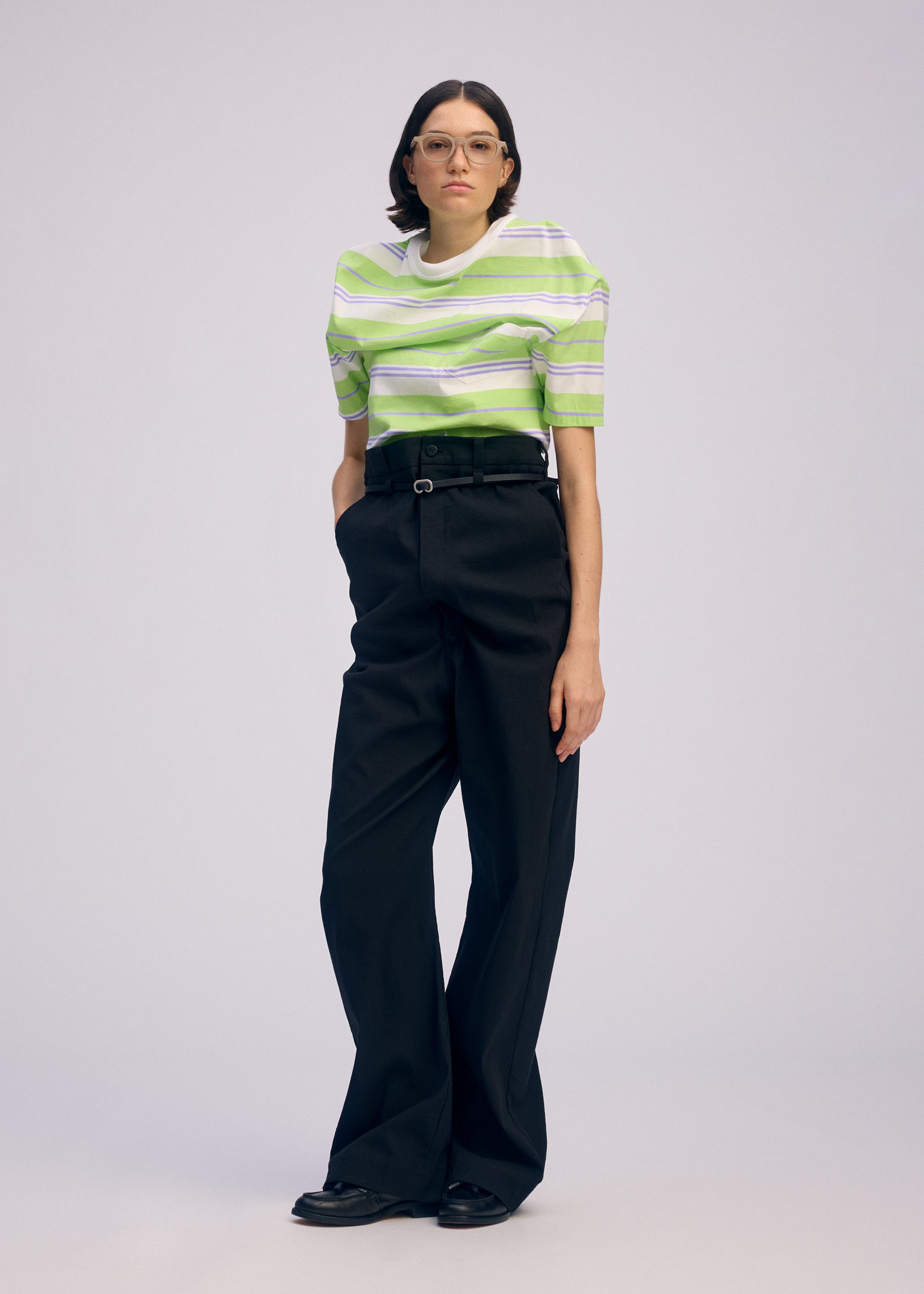 A model wears the ISSEY MIYAKE GENERIC WEAR trousers.