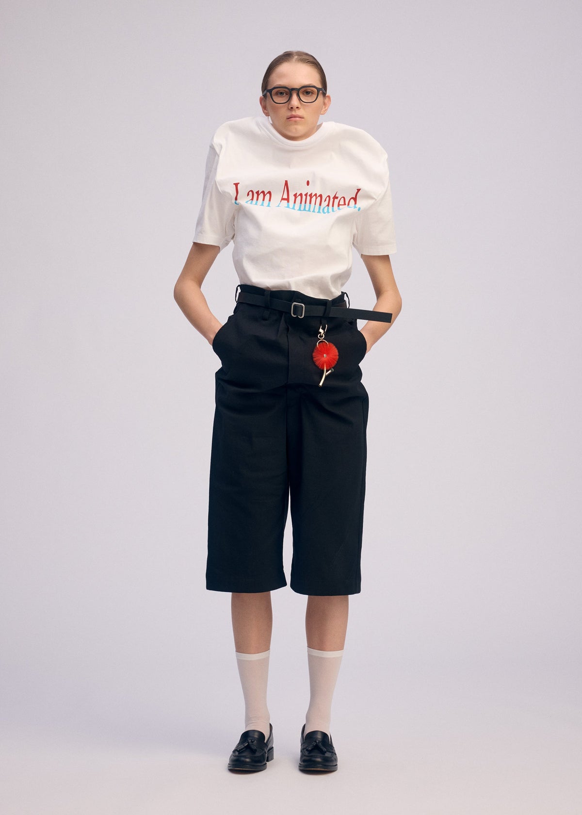 A model wears the ISSEY MIYAKE GENERIC WEAR trousers.