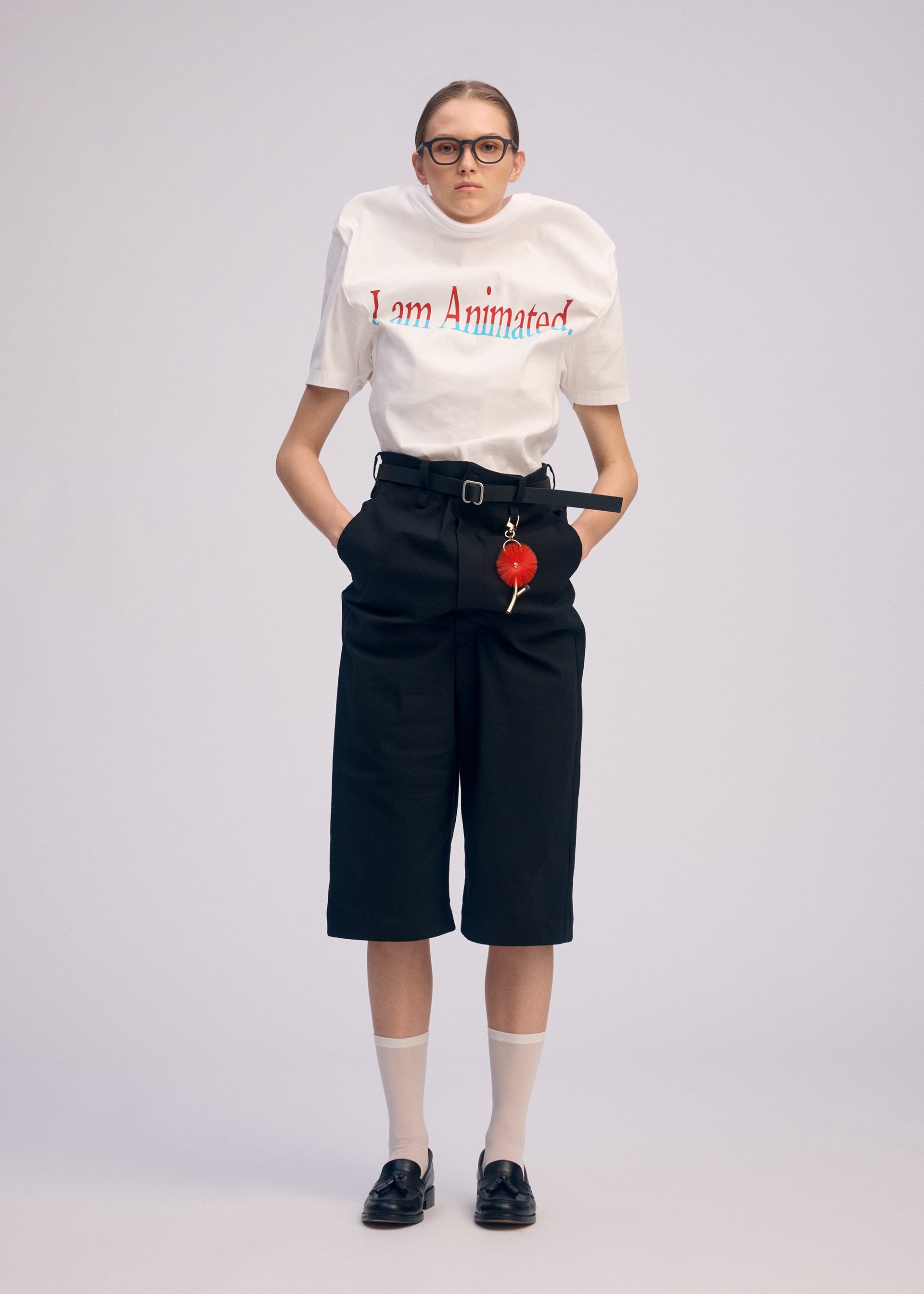 A model wears the ISSEY MIYAKE GENERIC WEAR trousers.