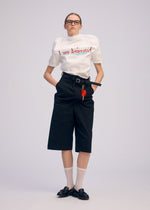 A model wears the ISSEY MIYAKE GENERIC WEAR trousers.