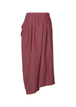A detail shot of the ISSEY MIYAKE TWISTED DRAPE trousers.
