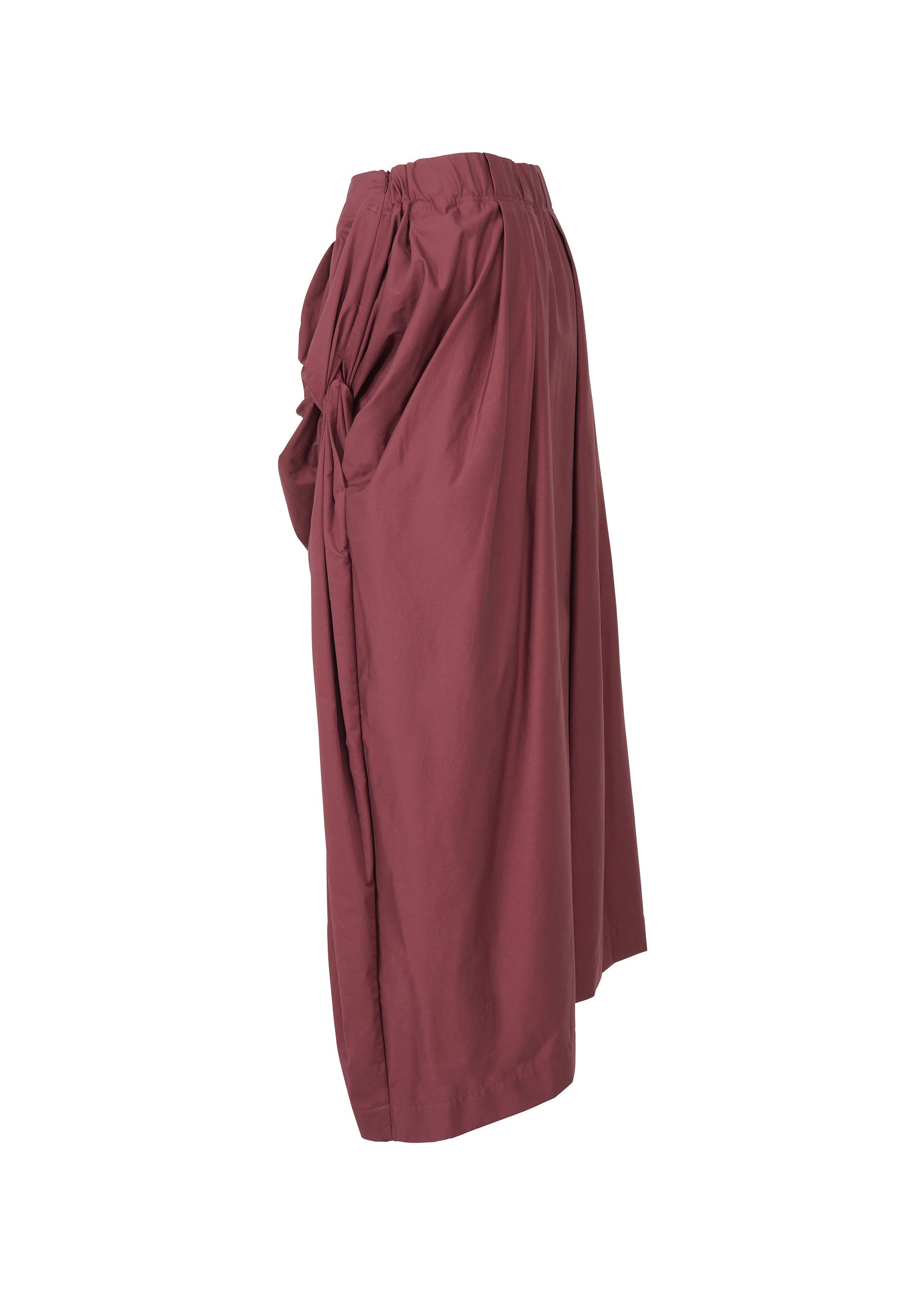A detail shot of the ISSEY MIYAKE TWISTED DRAPE trousers.