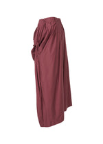 A detail shot of the ISSEY MIYAKE TWISTED DRAPE trousers.