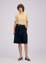 A model wears the ISSEY MIYAKE LOOPED trousers.