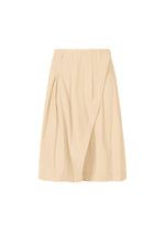 A product shot of the ISSEY MIYAKE LOOPED trousers in egg beige (49).