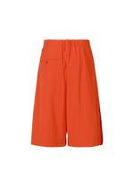 A detail shot of the ISSEY MIYAKE LOOPED trousers.