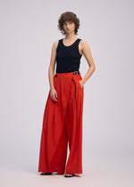A model wears the ISSEY MIYAKE LOOPED trousers.