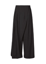 A product shot of the ISSEY MIYAKE LOOPED trousers in black (15).