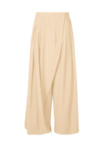 A product shot of the ISSEY MIYAKE LOOPED trousers in egg beige (49).