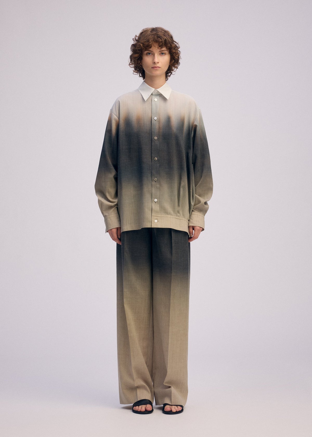 A model wears the ISSEY MIYAKE PLUMAGE plumage-trousers-chukar.