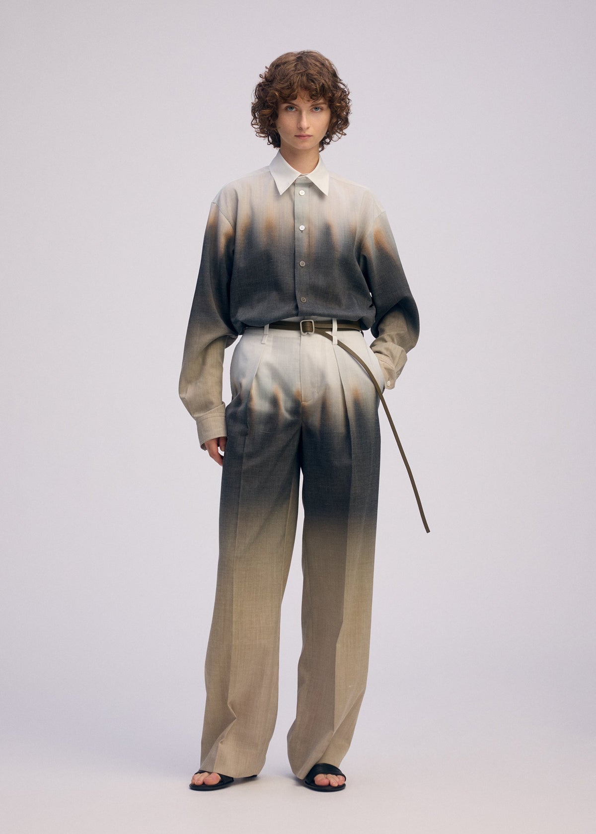 A model wears the ISSEY MIYAKE PLUMAGE plumage-trousers-starling.