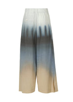 A detail shot of the ISSEY MIYAKE PLUMAGE trousers.