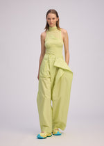 A model wears the ISSEY MIYAKE AKIMBO clothing.