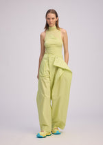 A model wears the ISSEY MIYAKE AKIMBO clothing.