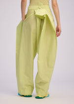 A model wears the ISSEY MIYAKE AKIMBO clothing.