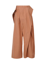 A detail shot of the ISSEY MIYAKE FLUTTERING PANTS trousers.
