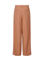 A detail shot of the ISSEY MIYAKE FLUTTERING PANTS trousers.