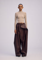 A model wears the ISSEY MIYAKE PRONOUNCED BODY clothing.